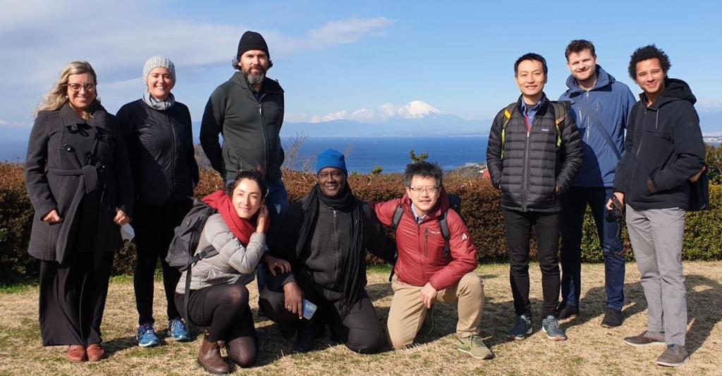 Photograph of the IPBES Scenarios and Models task force members, present in person, on a well-deserved break with Mount Fuji in the background, during the workshop in Hayama, Japan.